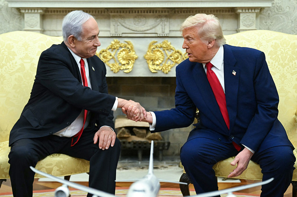 US President Donald Trump shakes hands with Israeli Prime Minister Benjamin Netanyahu