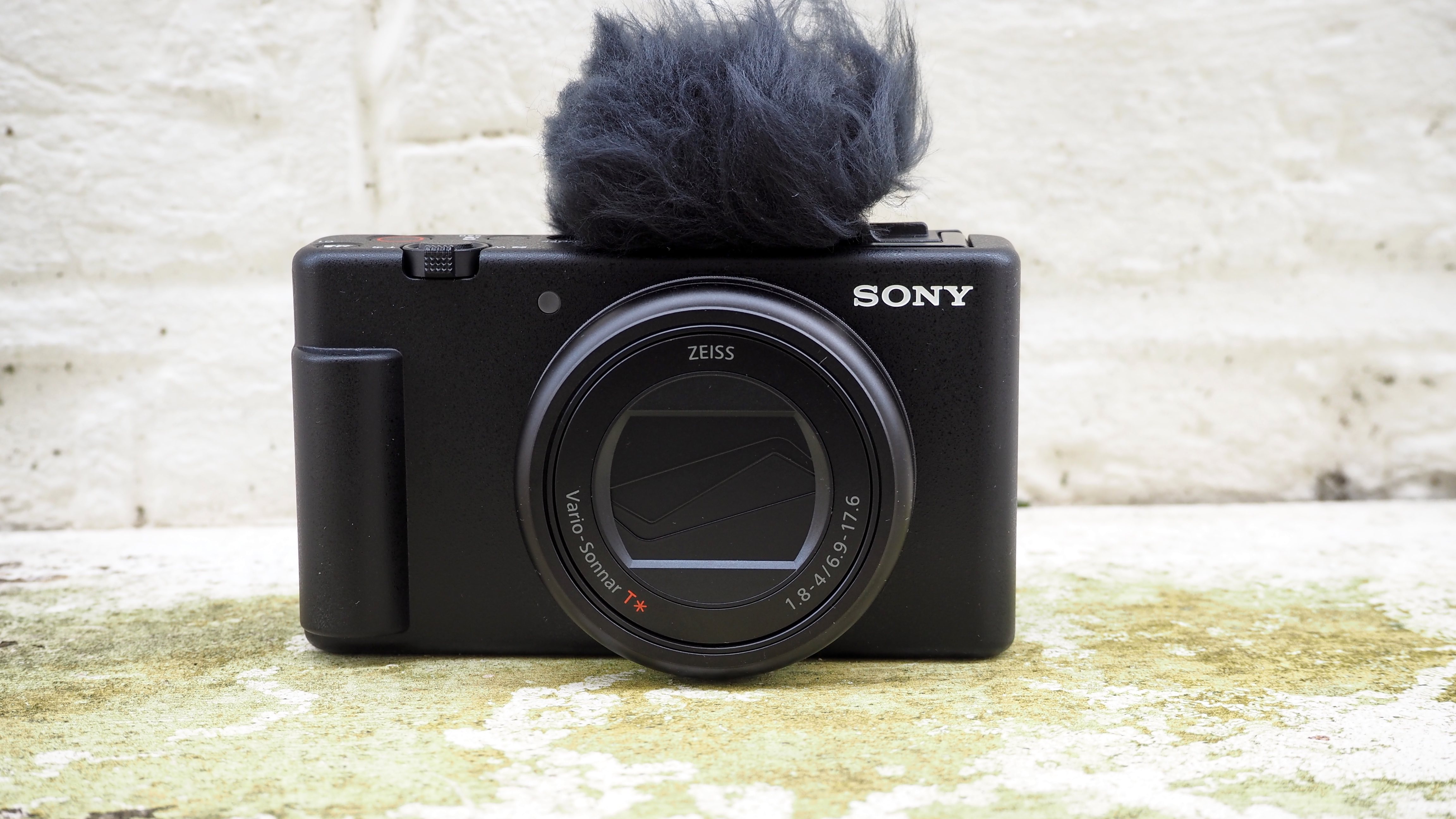 Sony ZV-1 II camera outside on a wall front with windshield attached over mic