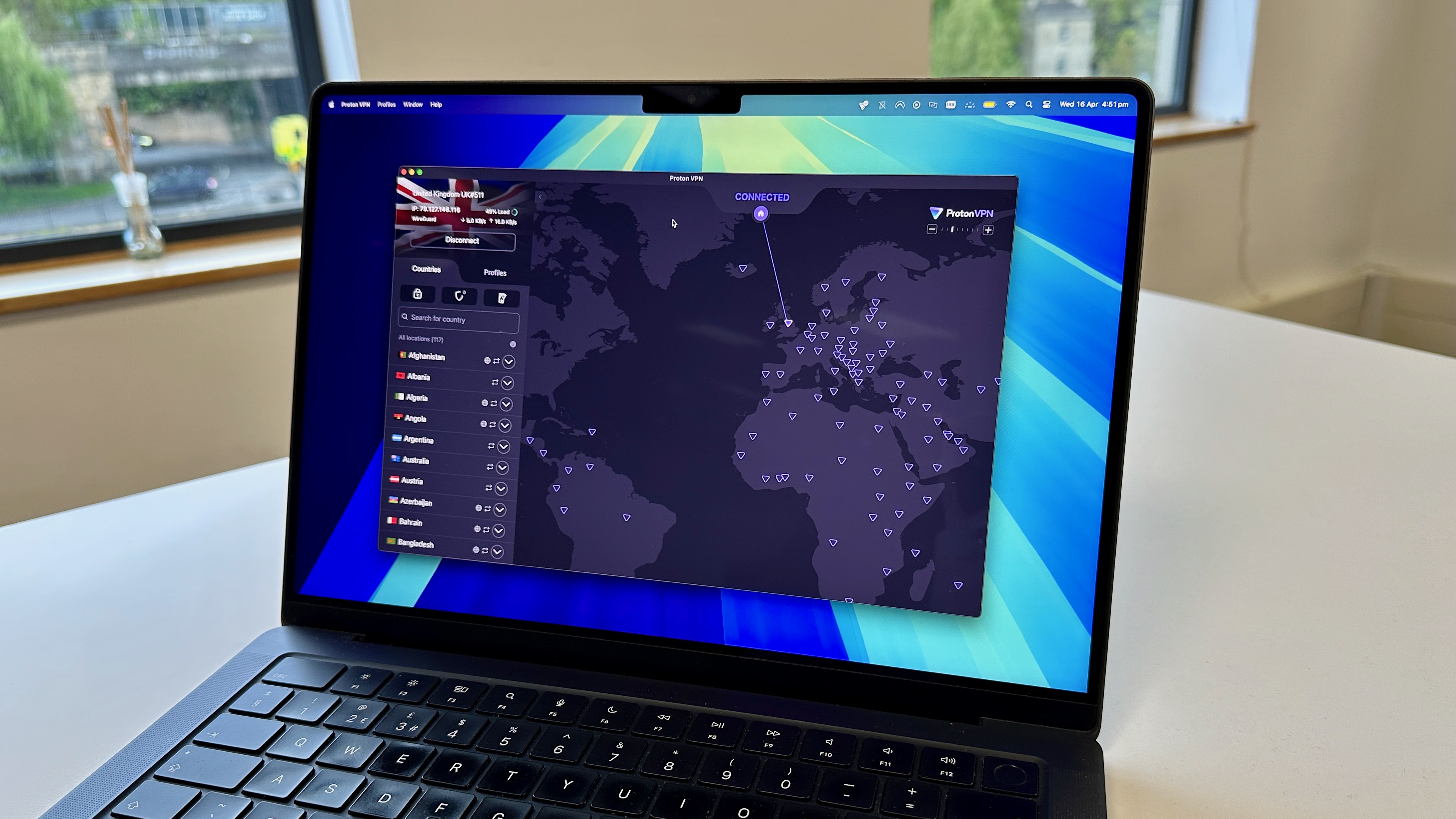 Proton VPN's homepage on its macOS app. On the left is a widget displaying Proton VPN's servers, with tabs for countries and profiles. Below is a search bar and a list of countries Proton VPN has servers in. On the right is a purple world map, with highlights on the countries where Proton VPN has servers.