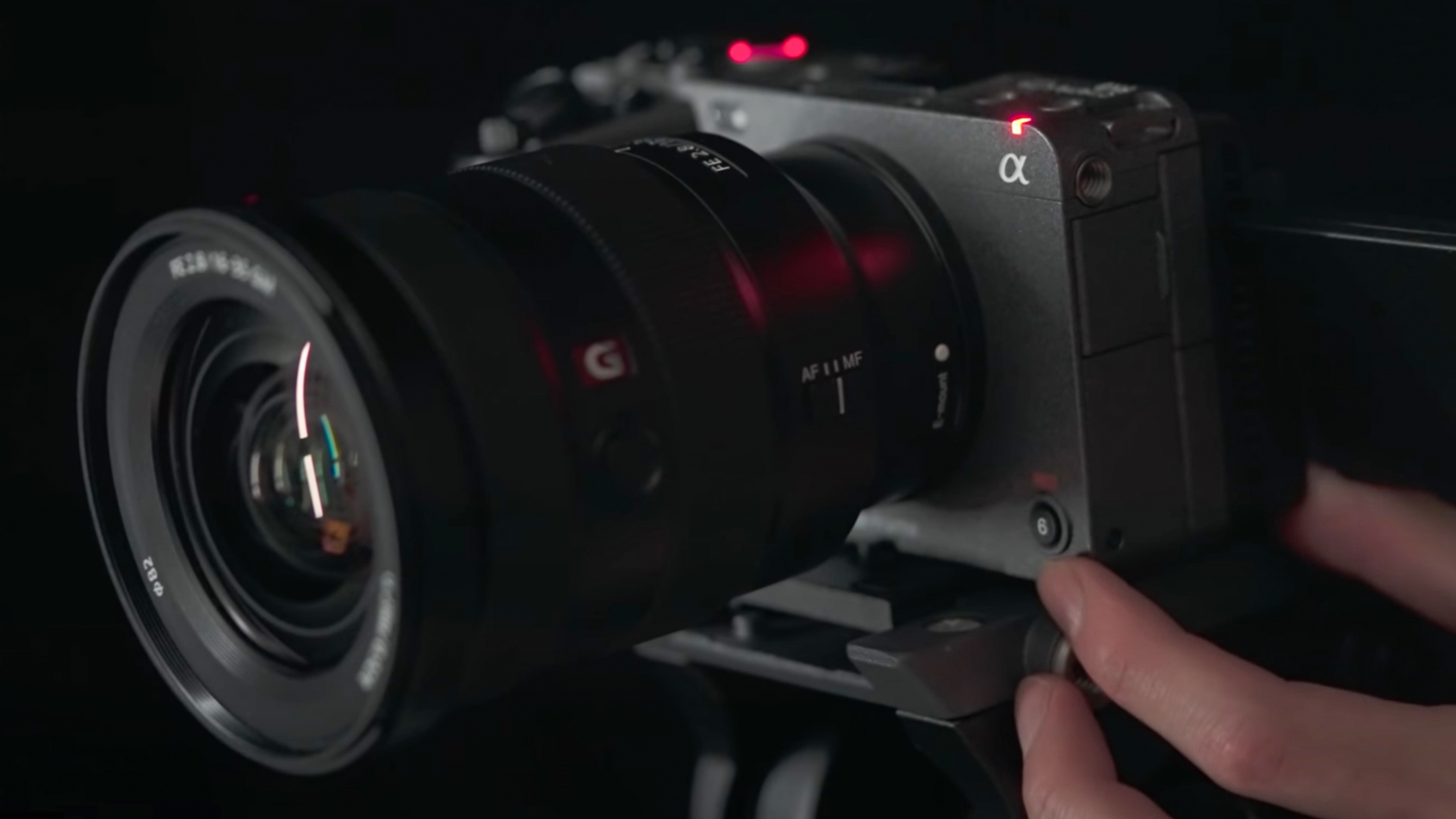 A hand holding the Sony FX3 camera