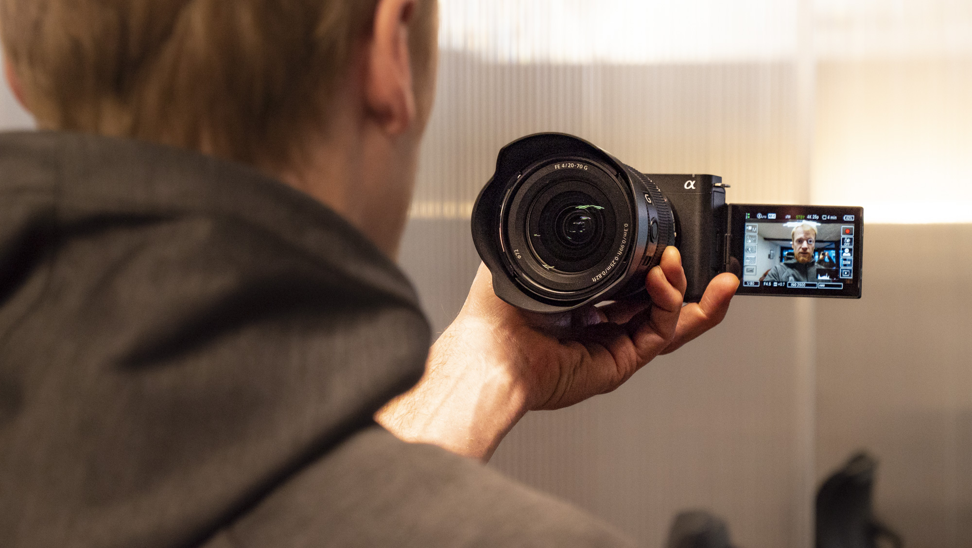 An hand holding the Sony ZV-E1 camera