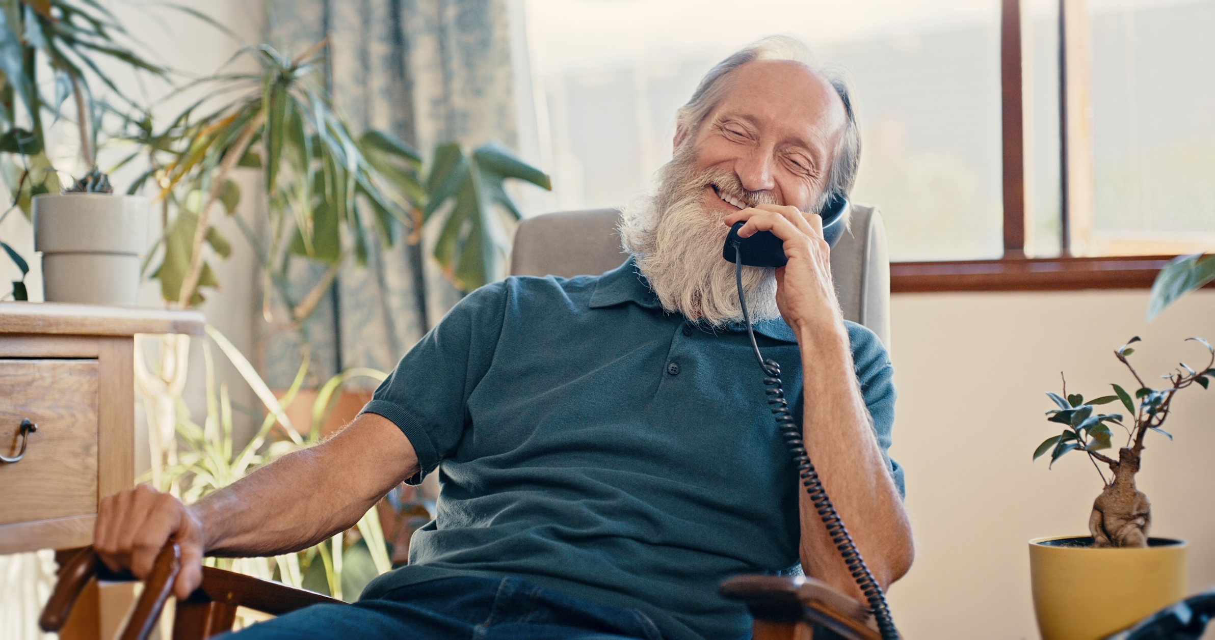 Man talking on his landline phone