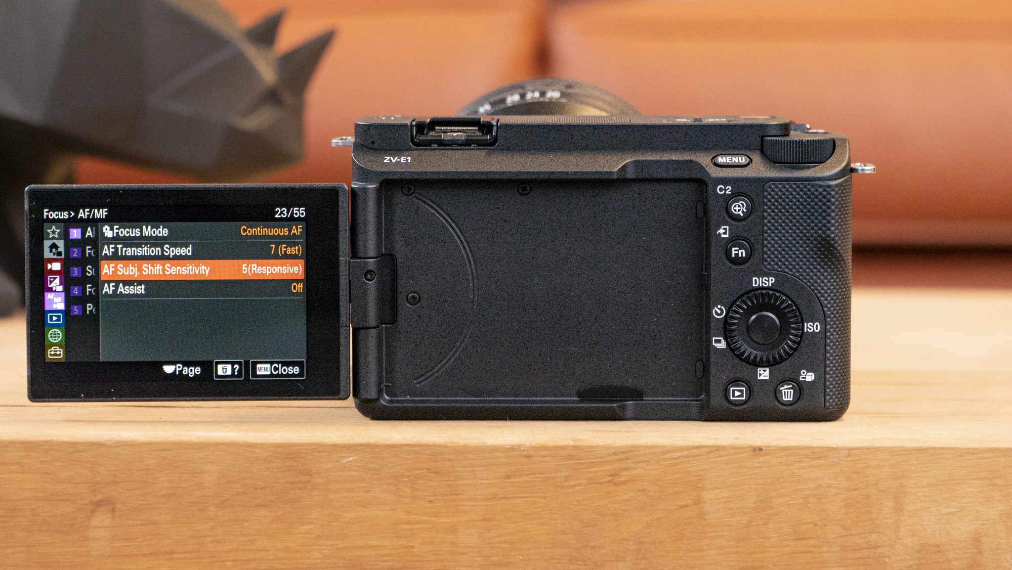 The Sony ZV-E1 camera sitting on a wooden table