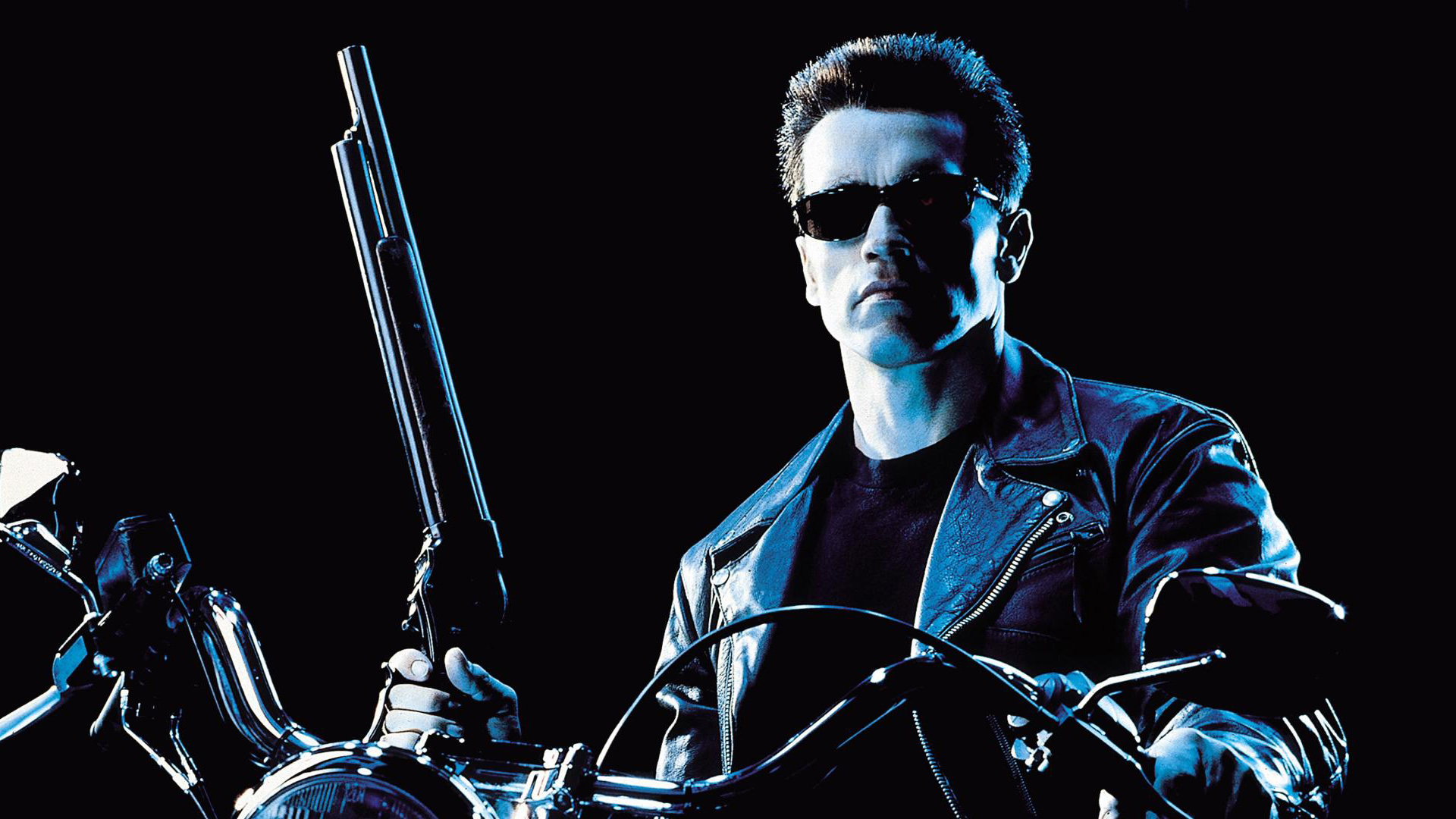 A still of Arnold Schwarzenegger as the T-800 holding a gun on a motorbike in Terminator 2: Judgment Day, one of the best free movies to stream this week