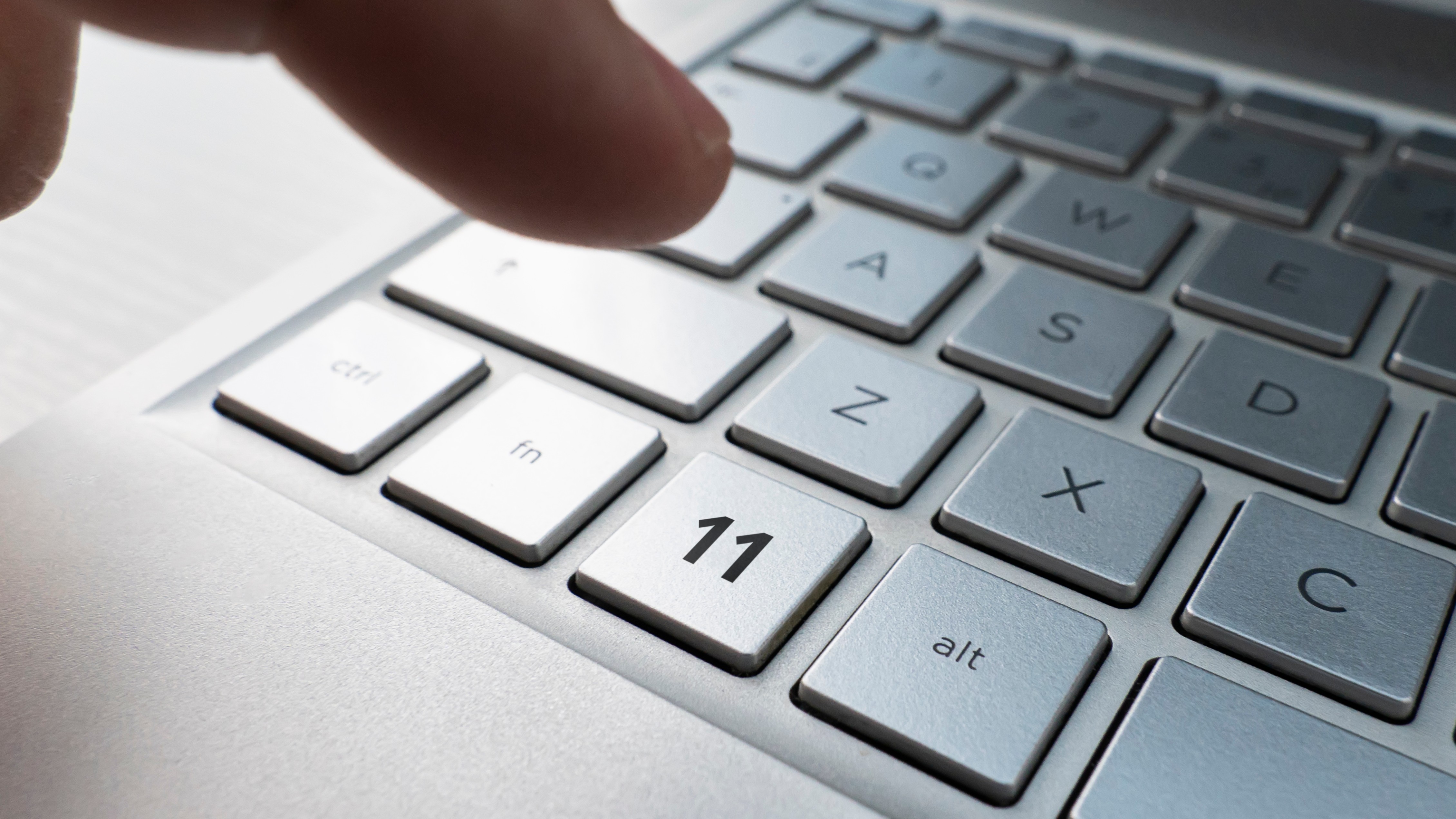 Close up of finger on keyboard button