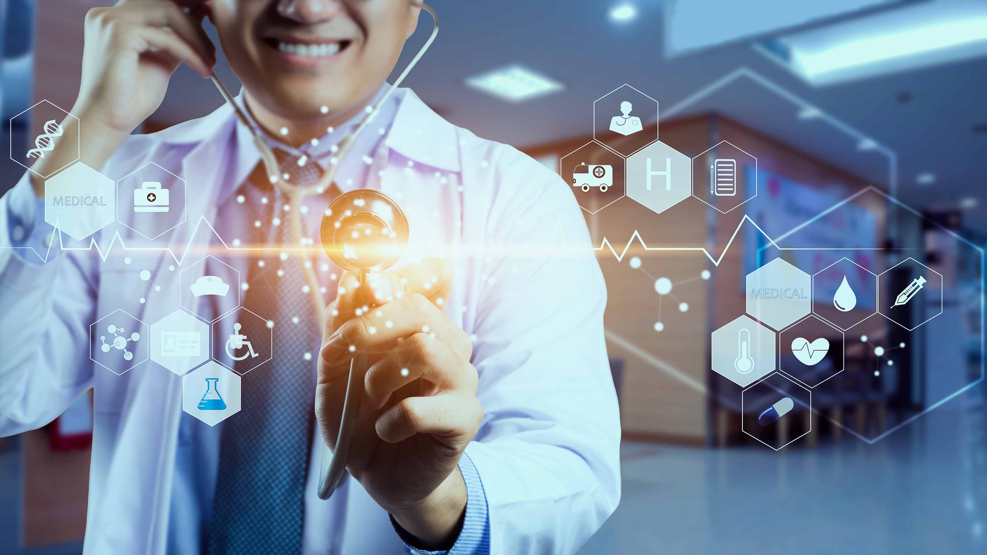 doctor holding stethoscope over virtual screen interface